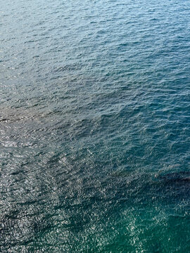 Sea blue calm water surface vertical.