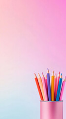 Fototapeta premium Colorful pencils in pink holder on gradient background