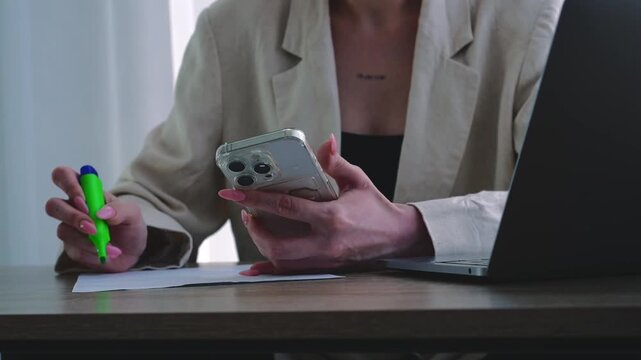 Office work.
The girl works diligently, striving to complete all assigned tasks.
She writes with a pen on a white sheet of paper, signs her name, and fills out forms.
Paperwork, filling out receipts f