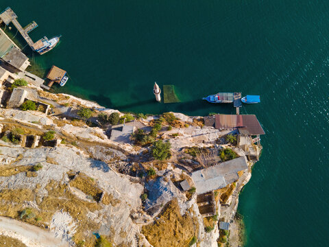 Savasan Village in Halfeti, Sanliurfa, T&uuml;rkiye, is partially submerged by the Euphrates due to the Birecik Dam, creating a striking scene of abandoned houses and rising waters.