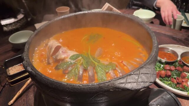 Homemade Chinese rice porridge congee in pot with ladle, healthy comfort food for recovery and daily nutrition
