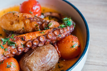 fried octopus with grilled vegetables on a plate © Наталья Маяк