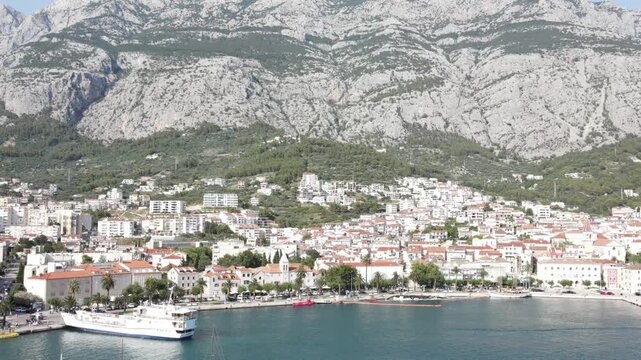 Makarska, Croatia. Coastal town, sea and mountains, Aerial photography from a drone. Croatian town on the Adriatic Sea. Makarska Riviera