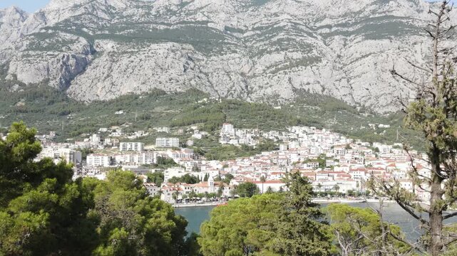 Makarska, Croatia. Coastal town, sea and mountains, Aerial photography from a drone. Croatian town on the Adriatic Sea. Makarska Riviera