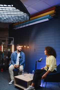 Content creators recording podcast in professional studio