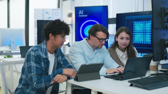 collaborative AI development team in modern tech office: young male developer coding on laptop, female team leader in light blue blazer pointing at code and neural network visualization	
