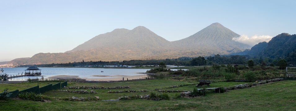 Atitlan lake at sunset with volcanos toliman and atitlan in the background. Tranquility and idyllic atmosphere