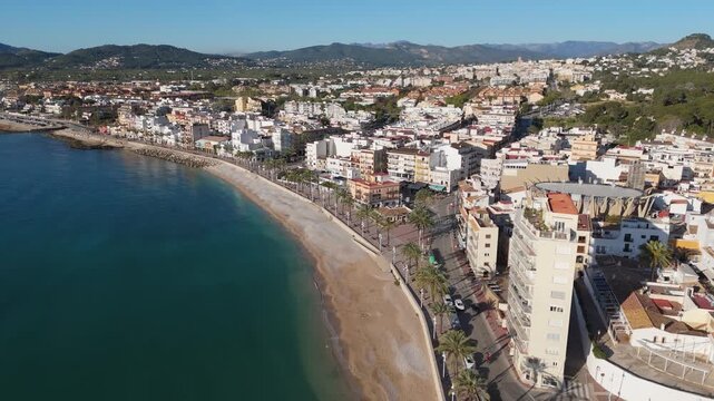 Drone flying above javea town beach in alicante spain