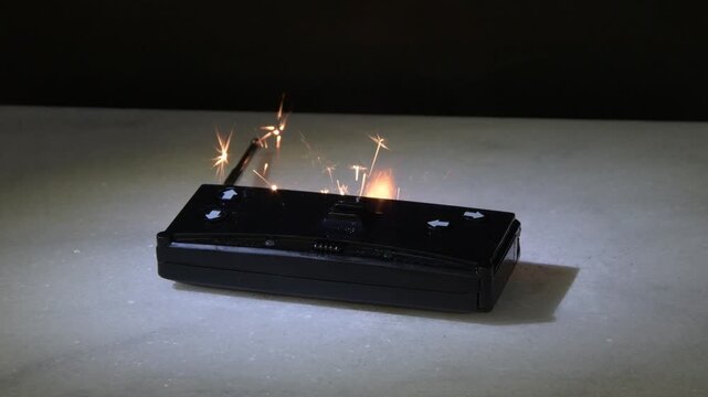Remote control sparks due to short circuit creating damage and fire threat