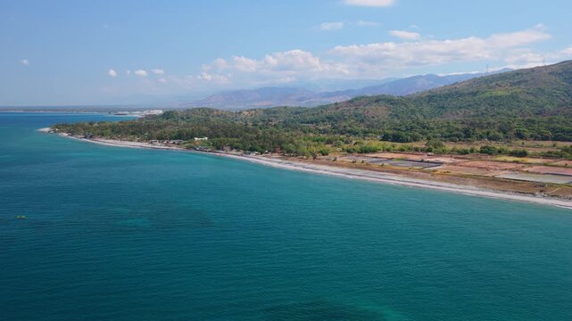 Scenic Panorama Drone Aerial Video of the crystal clear water and the beach and Mount Katung-uhan in Botolan, Zambales in the Philippines