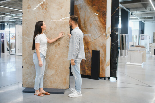Couple choosing large format tile for home renovation