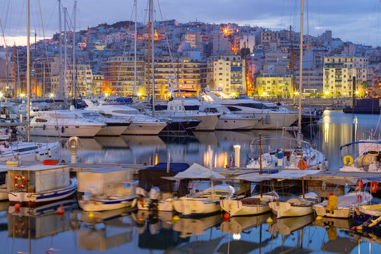 Marina Zeas at blue hour in Piraeus, Greece with yachts