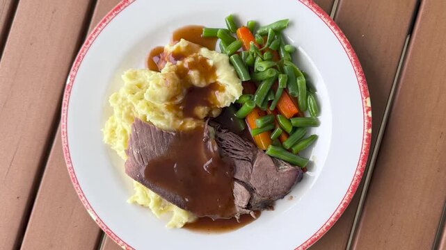 Rotating Plate of Beef Pot Roast with Mashed Potatoes