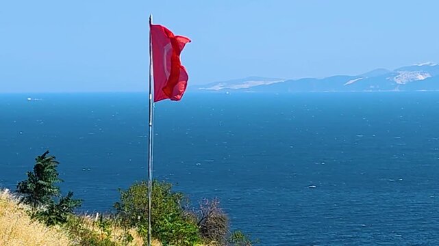 Cinematic View of the Turkish National Flag Waving Proudly on Ucmakdere Hills with Marmara Sea and Marmara Island in the Background - Scenic Coastal Landscape of Tekirdag, Turkey