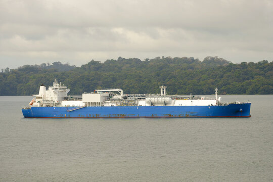 Blue Hull LNG Gas Tanker Ship At Anchor Waiting For Permit To Entry