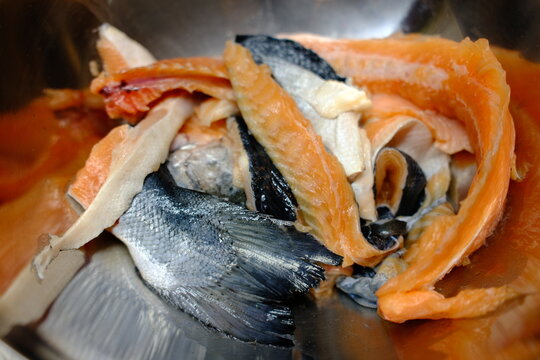 Norwegian salmon carcass for soup top view in metal bowl