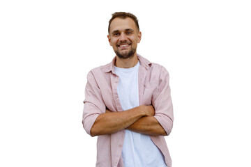 Smiling man posing with crossed arms, radiating confidence and friendliness, wearing a pink casual...