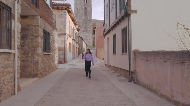 Local tourism in Spain near Madrid in Buitrago de Lozoya. aerial. Honduran latin, video conference