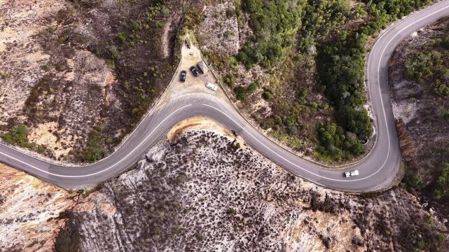 Top down aerial view over Lyell Highway in mountains at Queenstown in Tasmania.