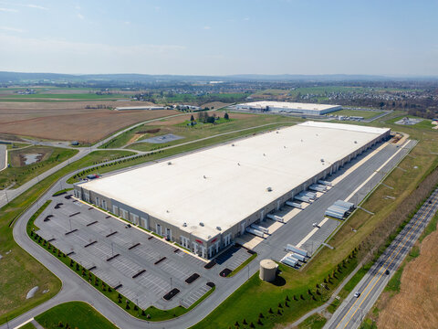 Aerial view of a large modern industrial warehouse and distribution center