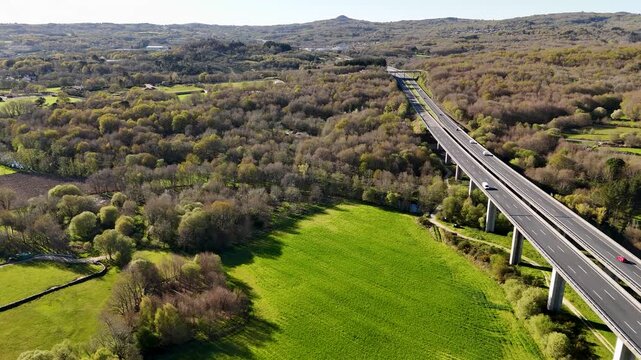 Highway viaduct bridge crossing green rural landscape