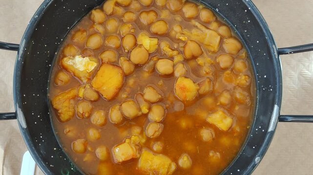 Traditional spanish chickpea and tripe stew cooking