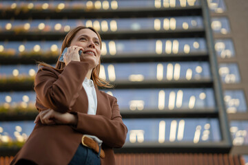 Businesswoman making important call in modern urban setting