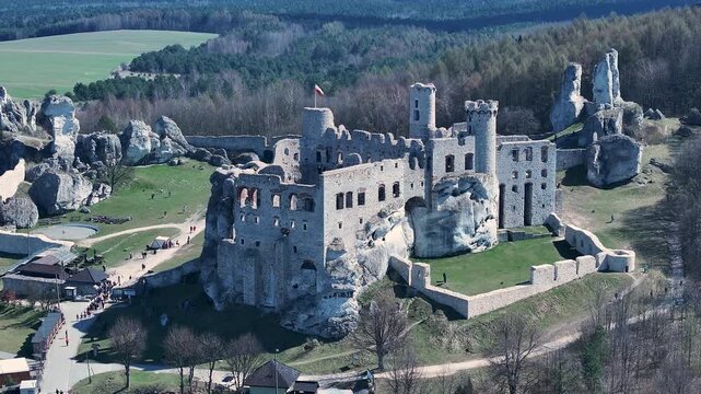 Aerial Poland Zamek Ogrodzieniec castle circle 1. Ruins of medieval castle south Poland. Original stronghold from 11th century, stone castle built in13th century. Rocky mountain top.