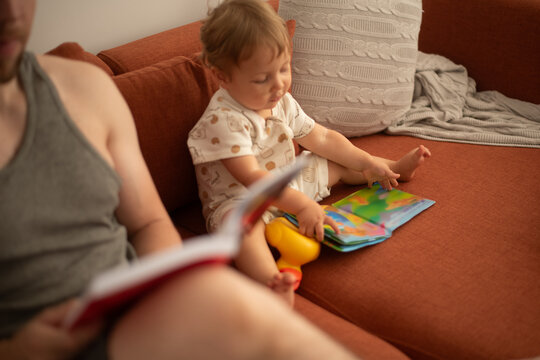 Father and son reading books