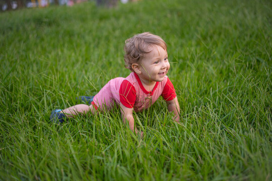 Happy baby on the grass