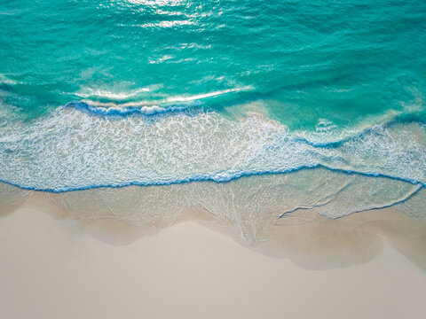 Aerial Drone Top Down View of Tropical Turquoise Ocean and White Sand Beach