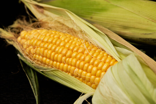 These photos showcase fresh Chodang corn, a popular Korean summer delicacy. With its green husks and bright yellow kernels, this super sweet corn offers a crisp, juicy, and fruity bite raw or cooked.