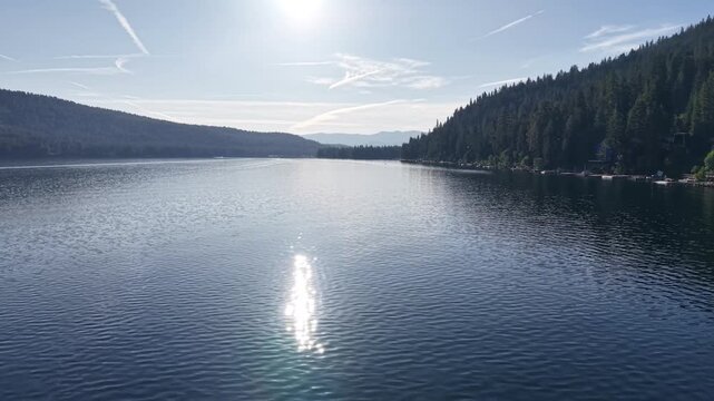 Aerial Drone View of Still Glassy Donner Lake with Silver Reflection at Dusk California
