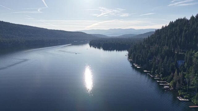 Aerial Drone View of Still Glassy Donner Lake with Silver Reflection at Dusk California