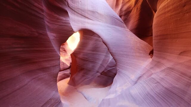 Flowing sandstone curves and vibrant layered patterns inside the narrow slot of Lower Antelope Canyon
