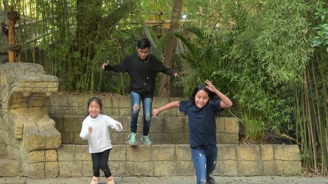Latino children having fun in the park.