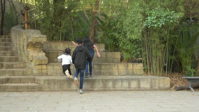  Latino children playing in the park
