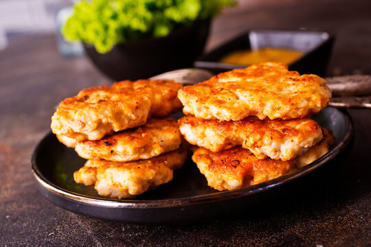 fried chicken cutlets in dark bowl