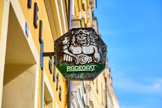 Radegast beer sign on historic building in sunny urban street scene. March 20, 2026, Slavonice, Czech Republic