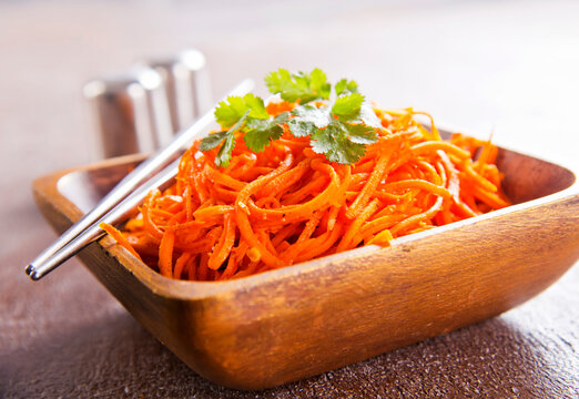 Carrot salad. French Grated Carrot Salad. Shredded carrot with garlic and black pepper