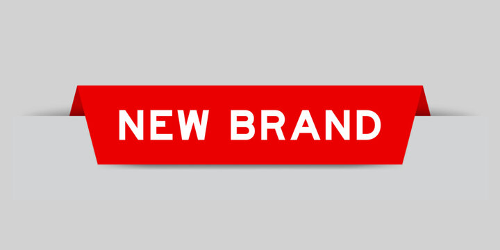 Red color inserted label with word new brand on gray background