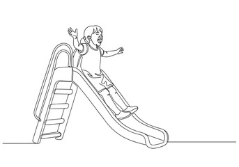 Obraz premium Happy child sliding down playground slide against playground background