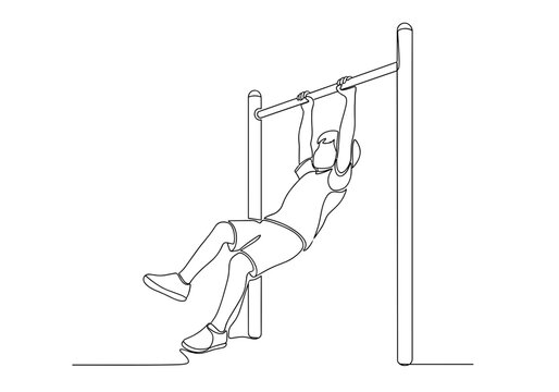 Child hanging on playground monkey bars against playground background
