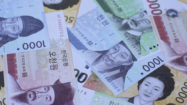 Korea, Korean cash bills, and the won currency for exchange and financial transactions. Korean won as a financial background for your design