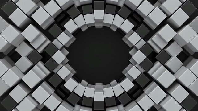 A circular arrangement of gray and black cubes forms an abstract background.