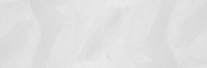 Fototapeta premium Panoramic white crumpled paper texture with subtle folds and highlights. This clean, high-resolution grunge background is perfect for minimalist banners creative headers and website overlays