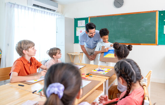 The teacher try to encorage African American boy to present his painting also explain the meaning of it in front of the classroom and friends also interest in his creation.