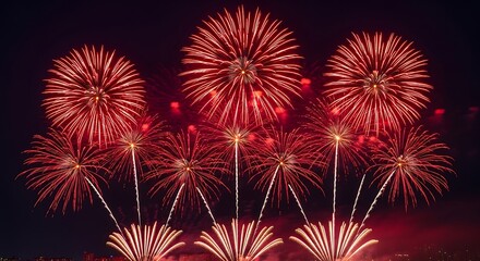 Fototapeta premium Stunning red fireworks display in the night sky during a celebration