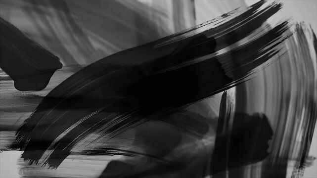 Abstract black brush strokes on a white background.