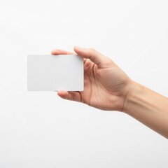 Obraz premium A hand holding a blank white business card against a plain background